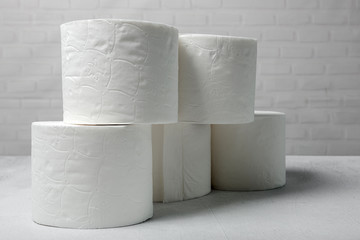 White rolls of toilet paper with white background