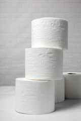 White rolls of toilet paper with white background
