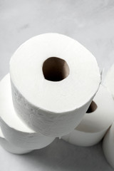 White rolls of toilet paper with white background