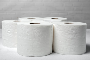 White rolls of toilet paper with white background