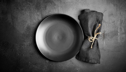 Empty porcelain plate on dark background, black, grey, culinary background, tableware, menu, cook,rustic, dish, dark, top view
