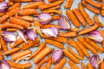 Baked, roasted or grilled carrot sticks with herbs and spices. Vegan food