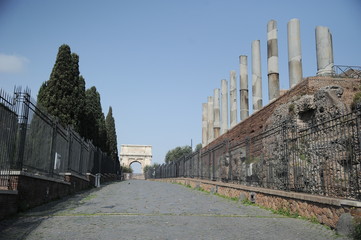 Rome, Italy-29 Mar 2020: Popular tourist spot Colosseum and Arch of Constantine is empty following the coronavirus confinement measures put in place by the governement, Rome, Italy