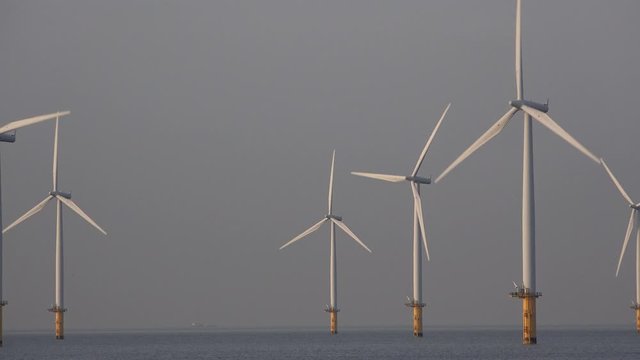 Offshore wind turbine farm off teesside North east England UK 4K