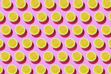 Trendy sunlight summer pattern with yellow lemon slice on pink background. summer concept.