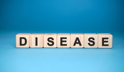 DISEASE word cube on a blue background. Medical concept.
