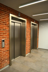 two elevators in the interior of a building