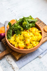 Vegetables stew with potato, carrot, cabbage and green spinach. Vegan food