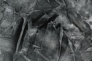 Black stucco with metallic spots. Dark gray volumetric texture.