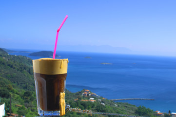 Greek frappe type coffee, overlooking the blue sea. Enjoyment