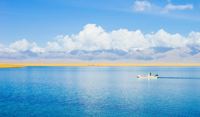 A boat sails in Sayram Lake, Xinjiang, China
