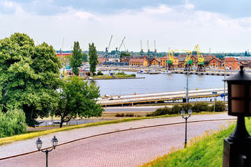 View from Rampart of Brave on Old Town quay in Szczecin docklands with Odra River, rustic dock...
