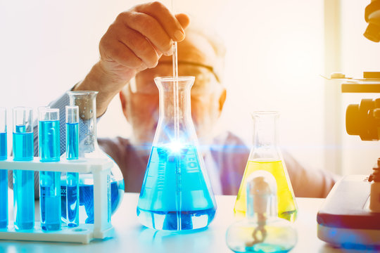 Scientist looking focus on new chemical vaccine formula successful to discover science research drug anti virus working in laboratory concept