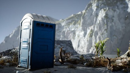 Portable mobile toilet in the beach. chemical WC cabin