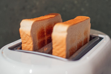 Sliced bread on a toaster