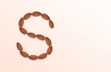 Letter S of the English alphabet from nuts. Food pattern made from nuts alphabet for shop and diet