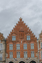Fototapeta na wymiar Façade gothique en briques sur la Grand Place d'Arras dans le Pas-de-Calais - Hauts de France