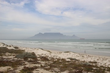 View of the beach, Atlantic Ocean and Table Mountain, in foggy weather. Cape Town, South Africa, Africa.