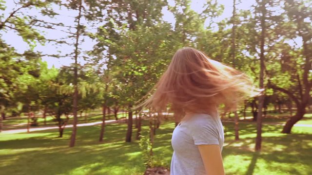 caucasian teen have fun outdoors summer landscape with sun beams happy freedom lifestyle slow motion