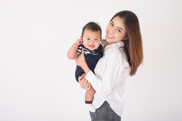 Happy newborn cute baby and beautiful mom in studio