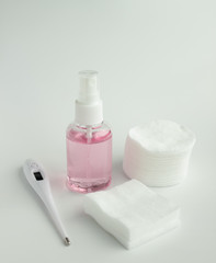 Protecting health from bacteria and viruses. Hand sanitizer, face mask and body thermometer.