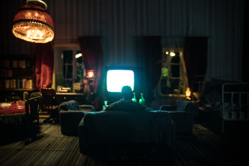 A realistic dollhouse living room with furniture and window at night. Artwork table decoration with handmade realistic dollhouse.