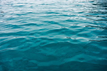 Turquoise ripple water surface on lake