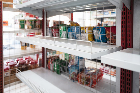 Lack of food product during an epidemic disease on market shelves in store