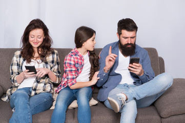 Offended feelings. Stop ignoring kid. Stuck in online. Ignored child. Busy parents surfing internet smartphones. Dad and mom ignoring daughter needs. Bad habits. Parenthood failure. Ignored baby
