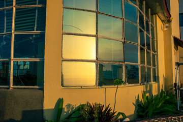 Sunset reflecting on a window in Havana, Cuba
