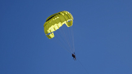 paragliding in the blue sky