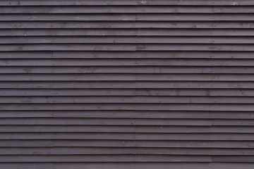 Obraz premium Scandinavian style of the wooden facade of the building. Black boards.