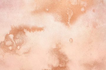 Peachy texture with gold paint leaks and stains. Craft Background.