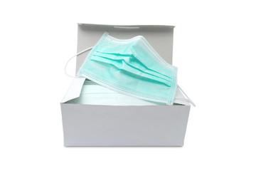 Pack of ear loop medical masks in box with medical mask on top isolated on white background with clipping path. anti virus and bacteria protective face air pollution, protection concept.