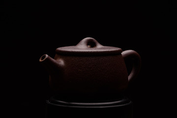 Chinese teapot on a black background