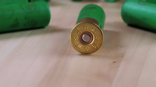 Closeup weathered green ammo cartridges for modern firearm stacked together in rows