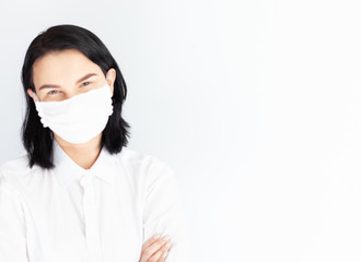 woman in medical mask on a white background