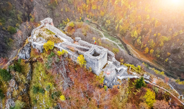 Aerial view of beautiful Poenari Citadel in autumn mountains