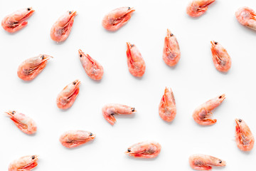 Shrimps - frozen - pattern on white background top view