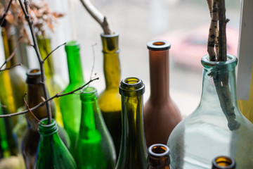 of glass bottles on the window