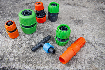 set of different connectors for garden hoses in different colors
