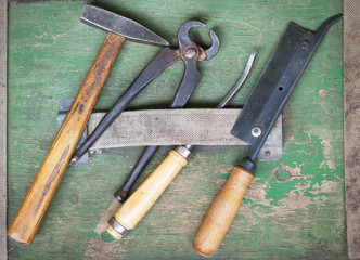 old carpentry tools on a wooden background