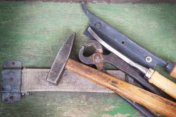 old carpentry tools on a wooden background