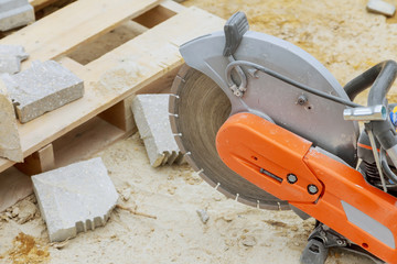 Concrete cutting with saw blade at construction site