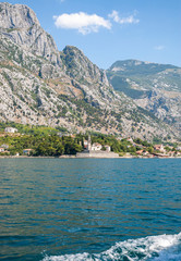 Fototapeta na wymiar View to the Perast Old Town, Saint Nicholas church and coast of Bay of Kotor, Montenegro