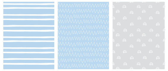 Abstract Hand Drawn Childish Style Seamless Vector Patterns. White Rainbows, Chevron and Spots on a Gray and Blue Background. Simple Irregular Geometric Vector Prints. Pastel Color Design.