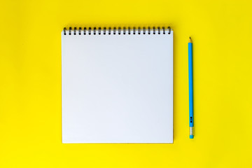 Notepad on a yellow background.
