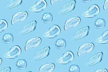 Group of transparent gel smears on blue background. Virus protection or cosmetics concept. Loopable elements.