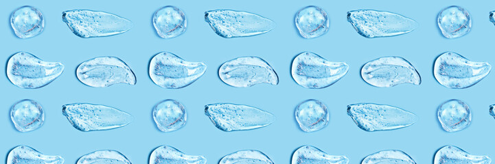 Smear of transparent gel on blue background. Virus protection or cosmetics concept.