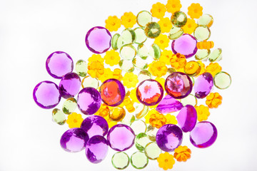 Wide view of autumn coloured clear beads.